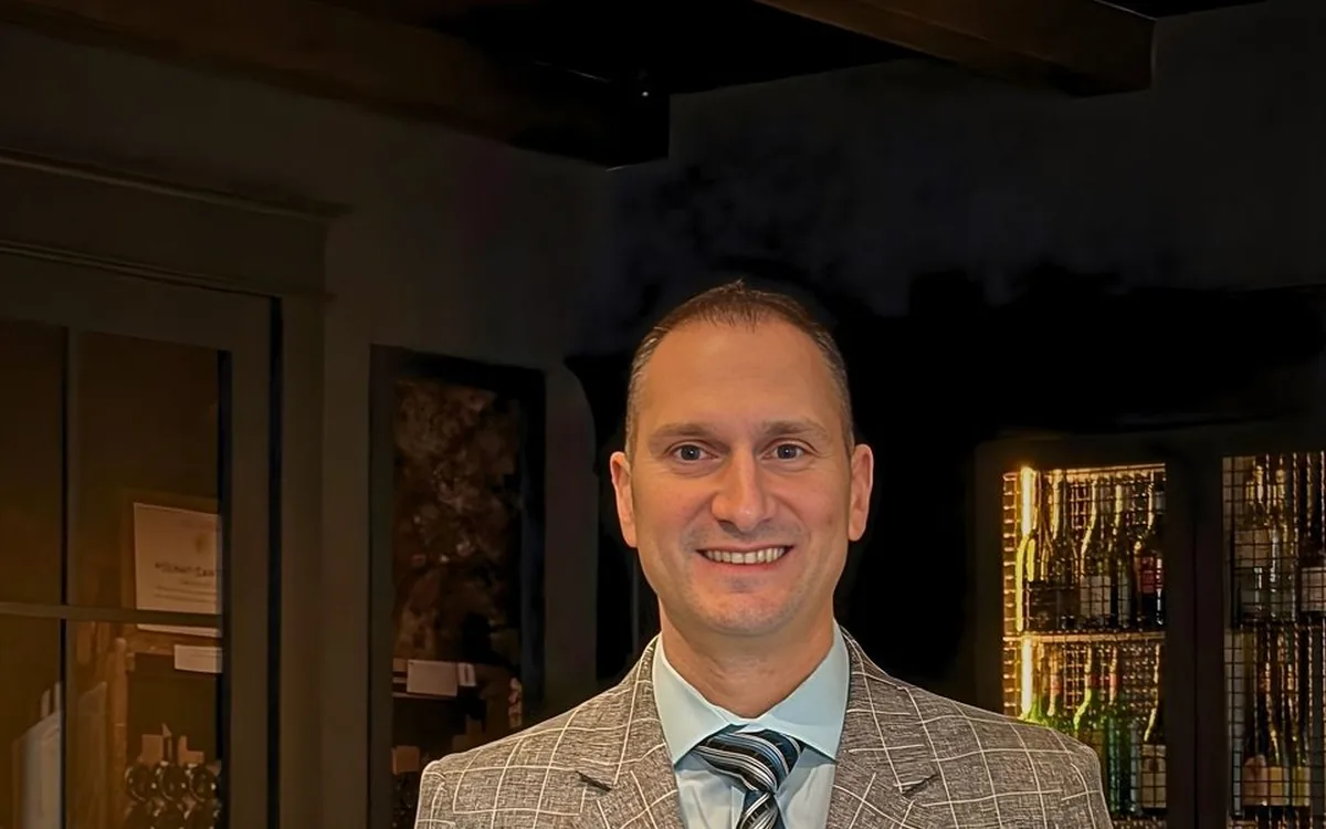 Dr. Dimitrios Jimmy Kilimitzoglou, founder of Enology Wine Bar and Bistro in Saint James